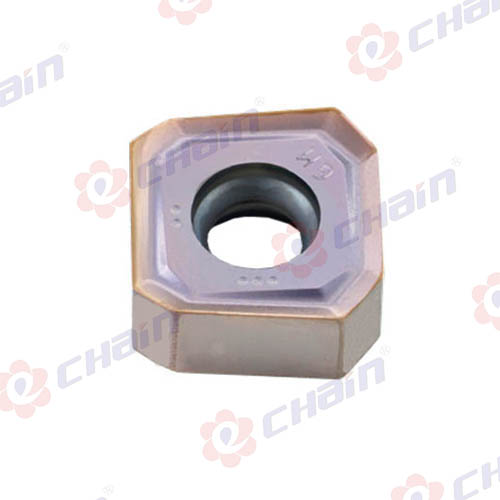 What are the considerations for selecting the right milling insert for a specific machining material